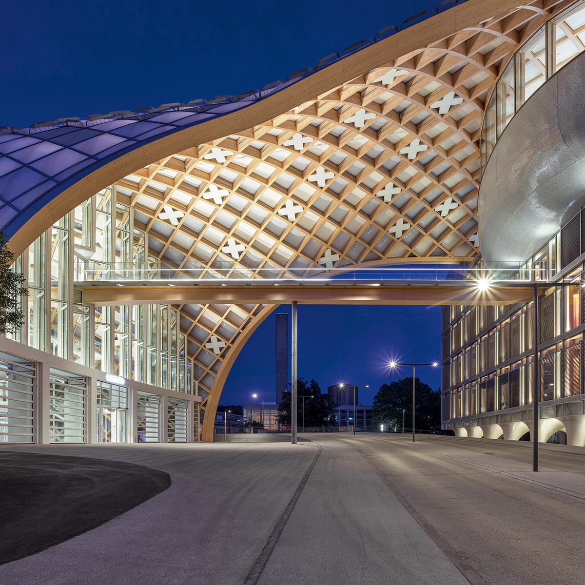 The building extends over the street to connect with the Cité du Temps, which houses the Omega and Swatch museums.